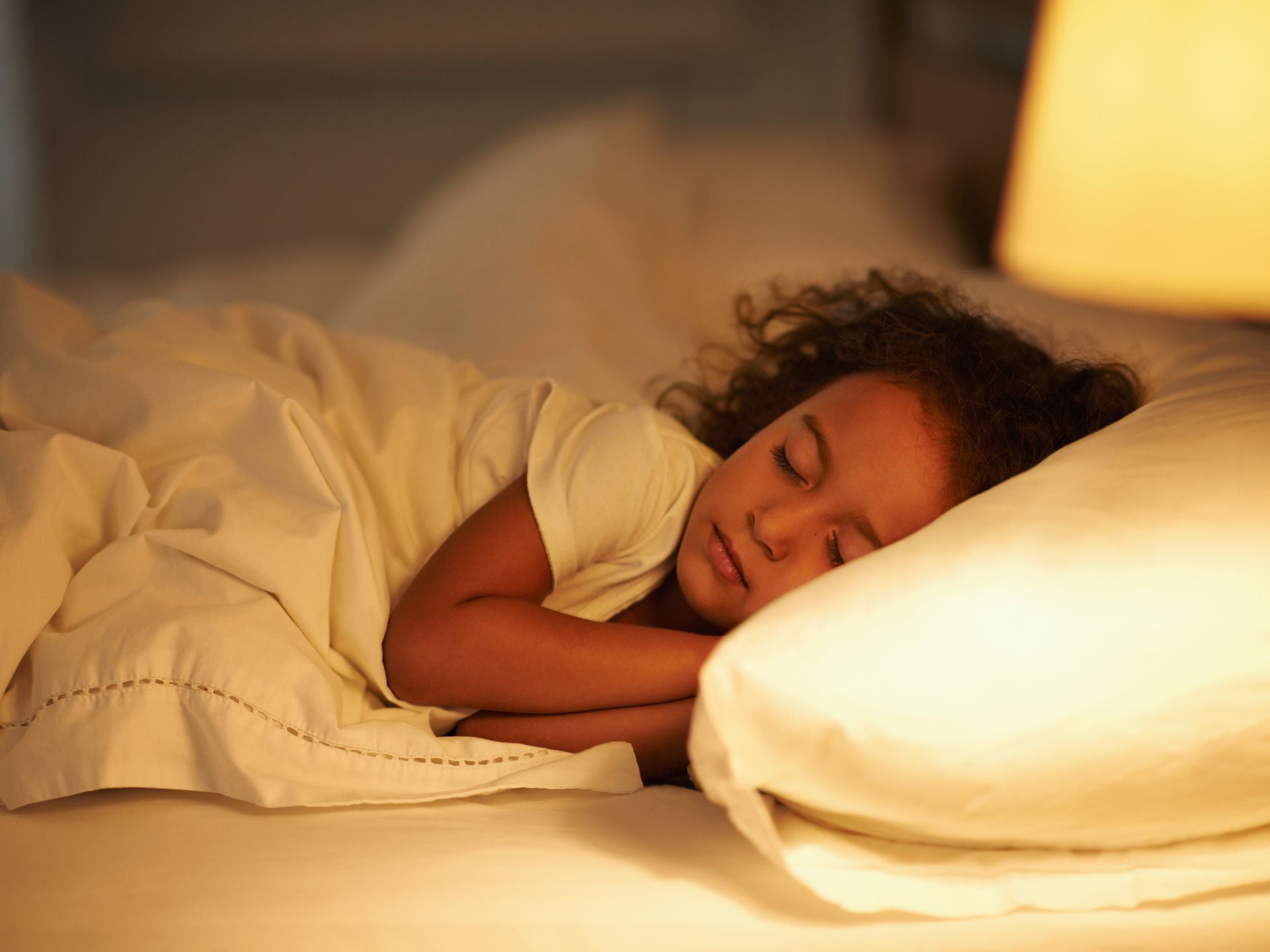 Child sleeping peacefully in an allergy friendly healthier bedroom